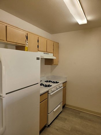 Kitchen refrigerator at Harvard Yard and Glenmary Apartments in Los Angeles CA